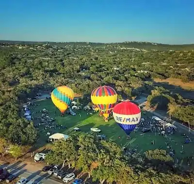 Aerial view of balloons and visitors at the festival